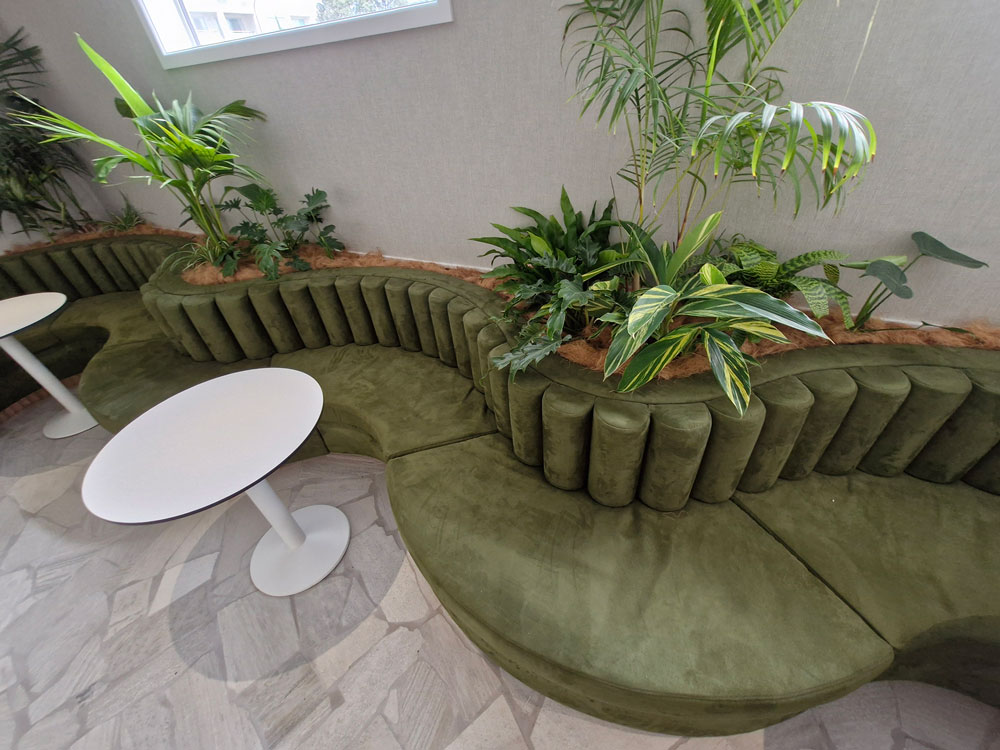 Bolsters made out of green fabric plus custom curved squab seating