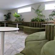 Closeup of bolsters made out of green fabric plus custom curved squab seating