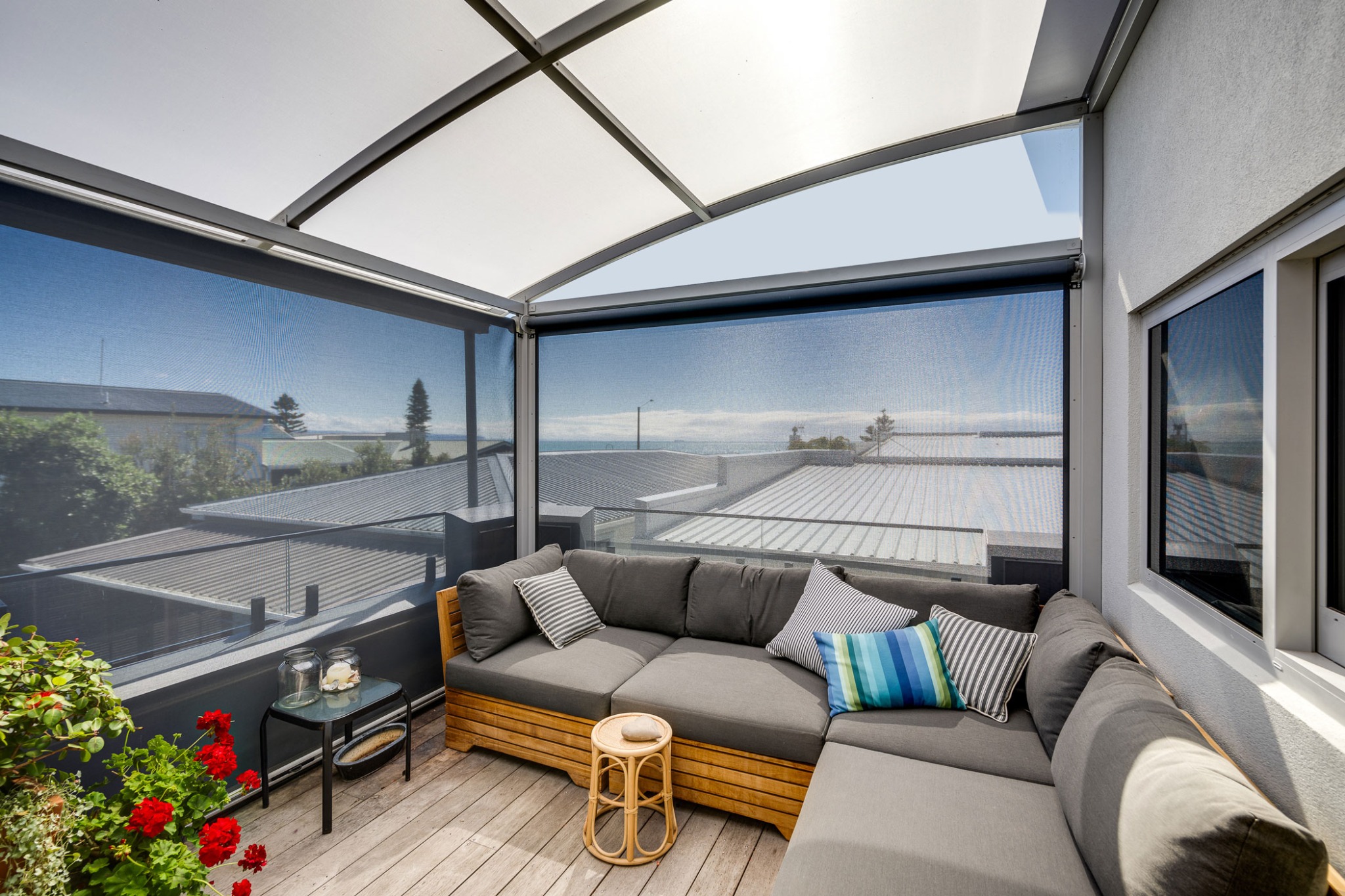 Curved-Canopy-Roof providing diffused light with ziptrak screens blocking uv rays