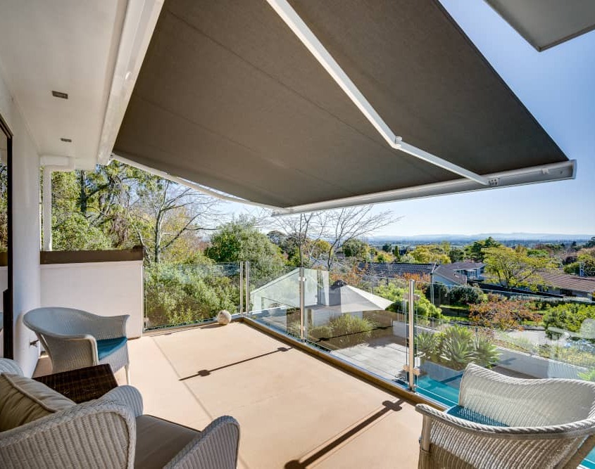 From the upper-level deck the Llaza retractable awning provides elegant shade for the deck and the bedroom within