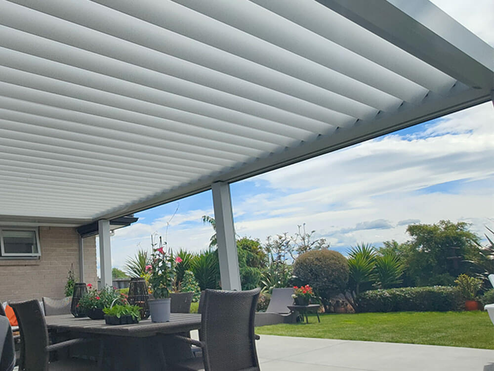 NZ Louvres Roof installed by Douglas Innovation provides shade and shelter for outdoor living space