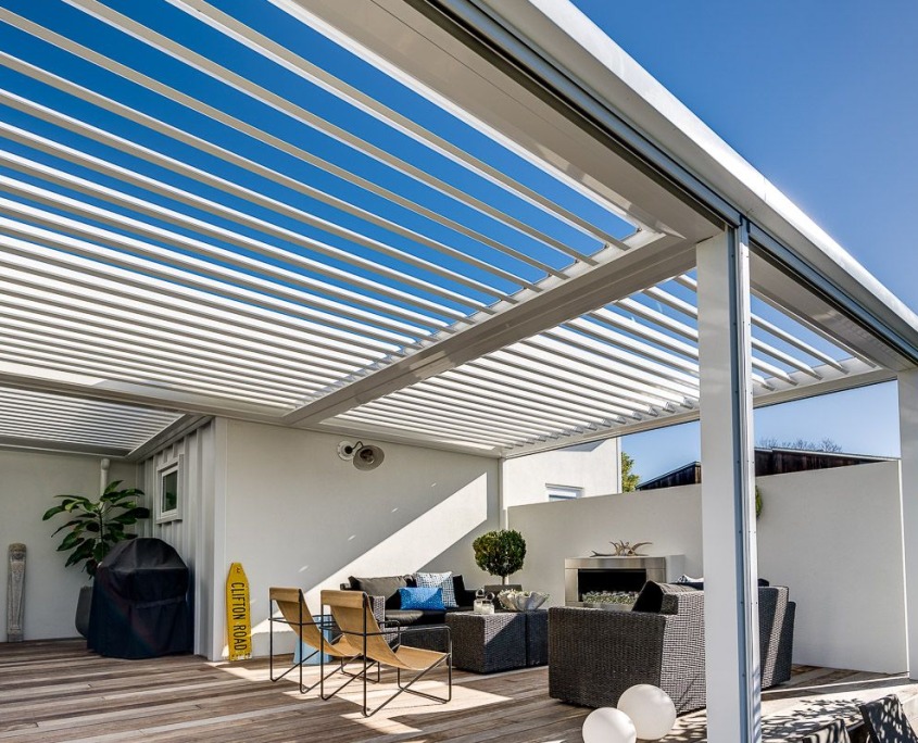 An open louvre roof on a fireside deck installed by Douglas Outdoor Innovations, Hawke's Bay.